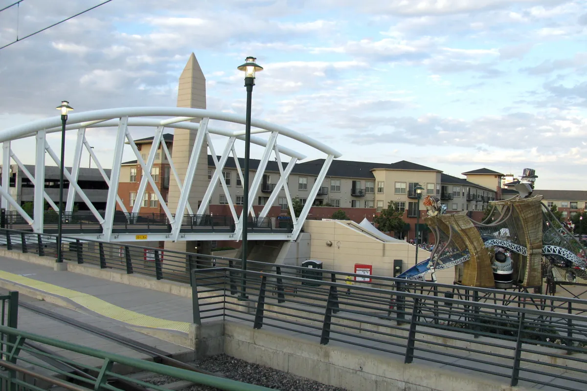 Apartments, public art and the light rail pedestrian bridge in Englewood, Colorado